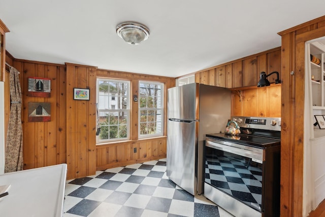 37 Main St, Raymond, ME 04071 - kitchen with wood walls, tile patterned floors, and stainless steel appliances