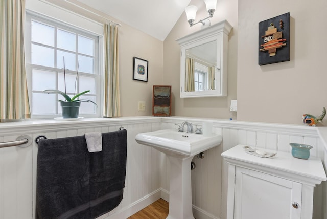 37 Main St, Raymond, ME 04071 - bathroom with wood finished floors, a sink, lofted ceiling, and a wainscoted wall