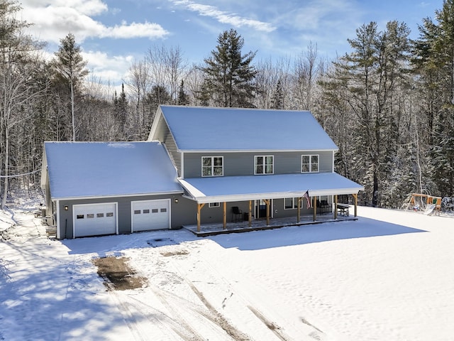 view of front of home featuring a garage and covered porch