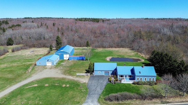 view of subject property featuring a forest