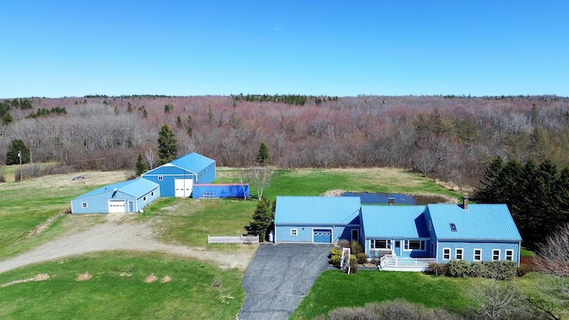 view of subject property featuring a forest