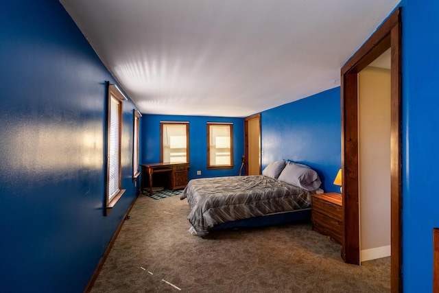 bedroom featuring carpet flooring and baseboards