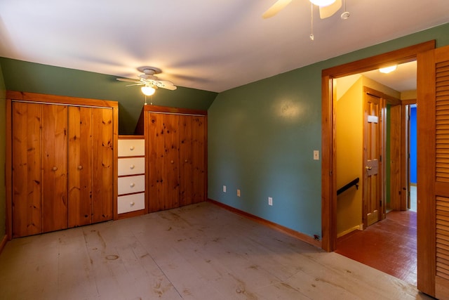 additional living space featuring ceiling fan, wood finished floors, vaulted ceiling, and baseboards