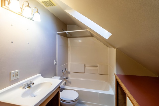 full bath with a skylight, toilet, bathing tub / shower combination, vanity, and lofted ceiling