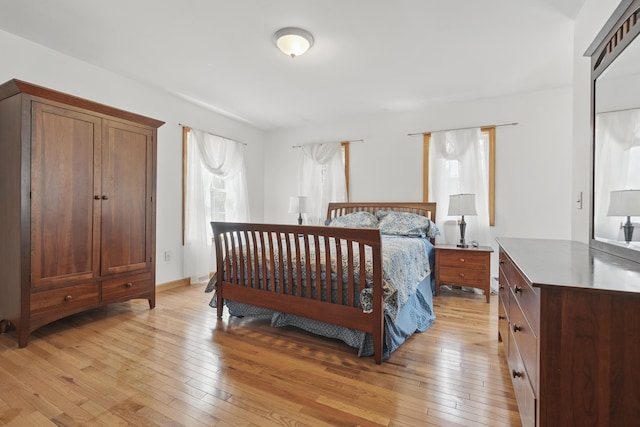 bedroom featuring light wood-style flooring