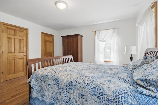 bedroom with wood finished floors