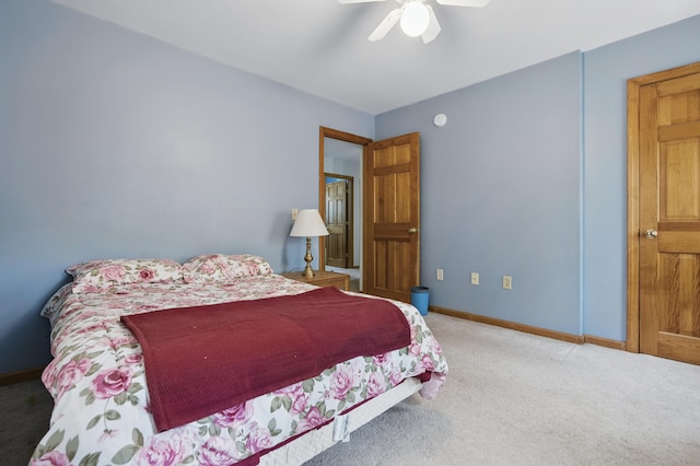 carpeted bedroom featuring ceiling fan and baseboards