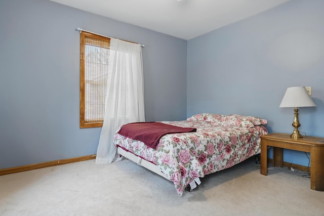 carpeted bedroom with baseboards