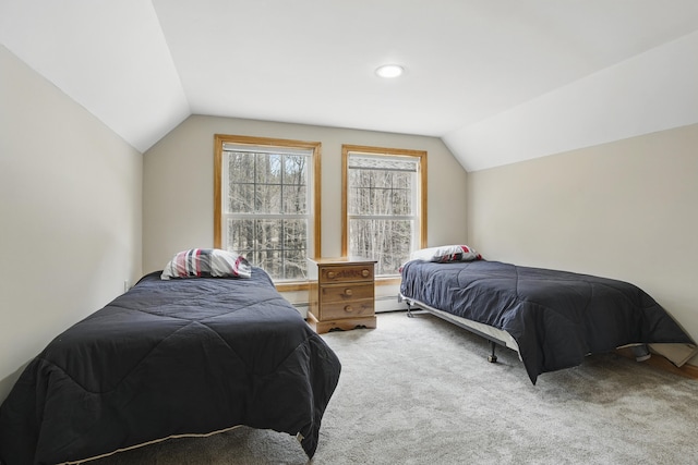 bedroom featuring a baseboard radiator, vaulted ceiling, and carpet floors