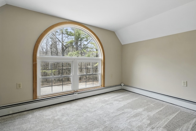 carpeted spare room featuring vaulted ceiling and baseboard heating