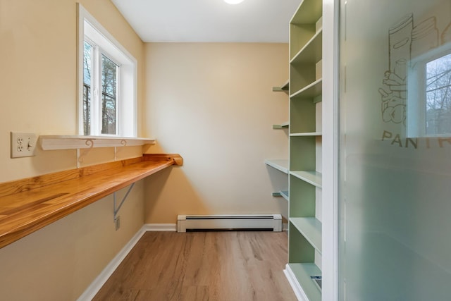 interior space with a baseboard radiator