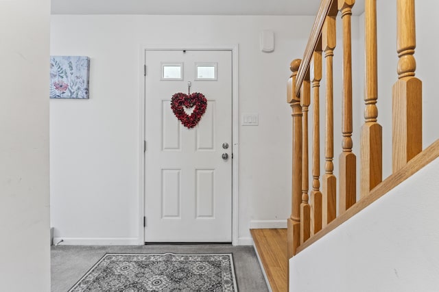 6 Jackson Ln, Kennebunk, ME 04043 - entryway featuring baseboards, wood finished floors, and stairs