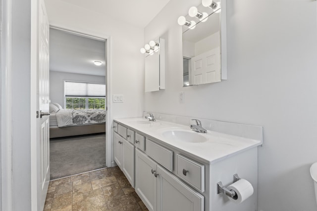 6 Jackson Ln, Kennebunk, ME 04043 - ensuite bathroom with stone finish floor, double vanity, ensuite bath, and a sink