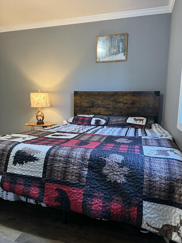 bedroom with ornamental molding