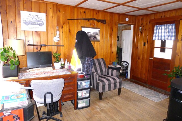 office featuring wood finished floors and wood walls