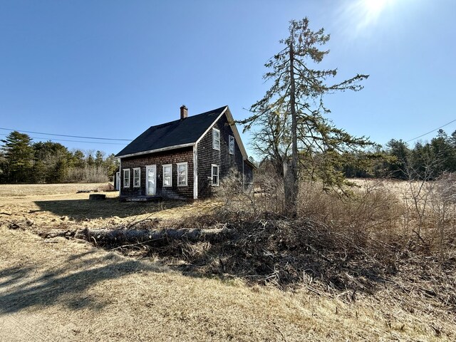 view of home's exterior featuring a chimney