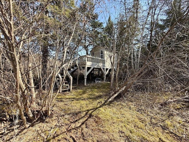 exterior space with a deck and stairs