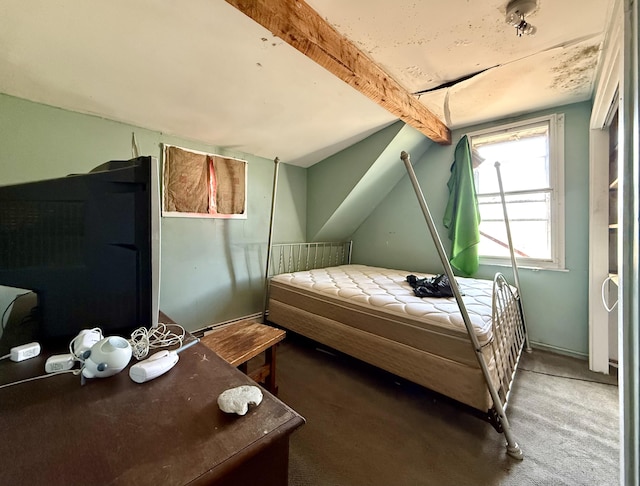 carpeted bedroom featuring beam ceiling