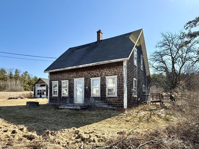 rear view of house with a chimney