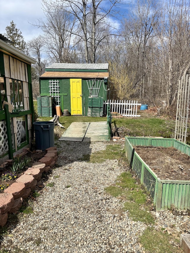 view of yard featuring fence and an outdoor structure