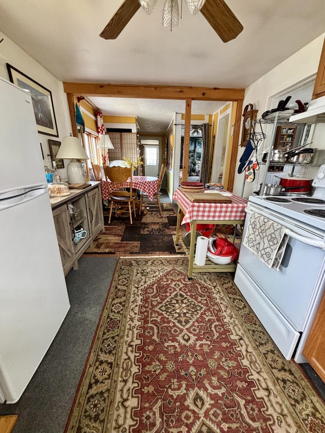 kitchen featuring ceiling fan, carpet, under cabinet range hood, and white appliances