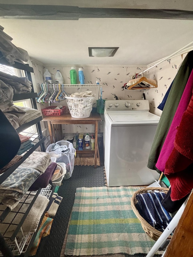 clothes washing area featuring laundry area, washer / clothes dryer, and carpet floors