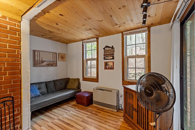 37 Torsey Shores Rd, Readfield, ME 04355 - sitting room featuring wooden ceiling, wood finished floors, and heating unit