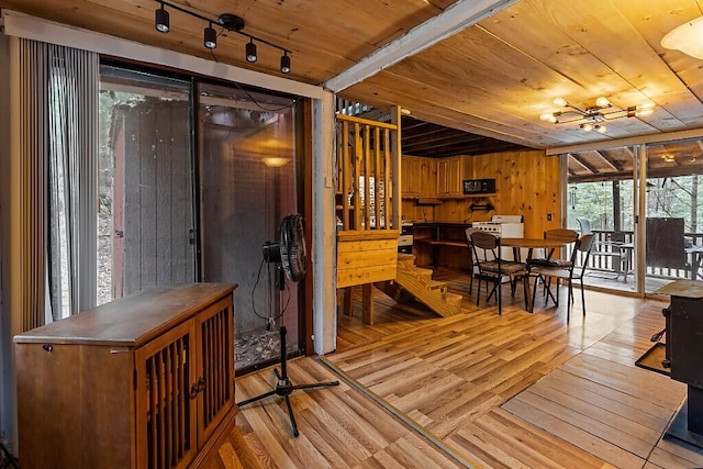 37 Torsey Shores Rd, Readfield, ME 04355 - dining room featuring wood ceiling, light wood finished floors, wood walls, a chandelier, and track lighting