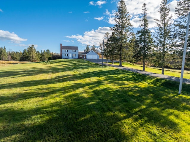 812 County Rd, Lubec, ME 04652 - view of green lawn with a garage and driveway