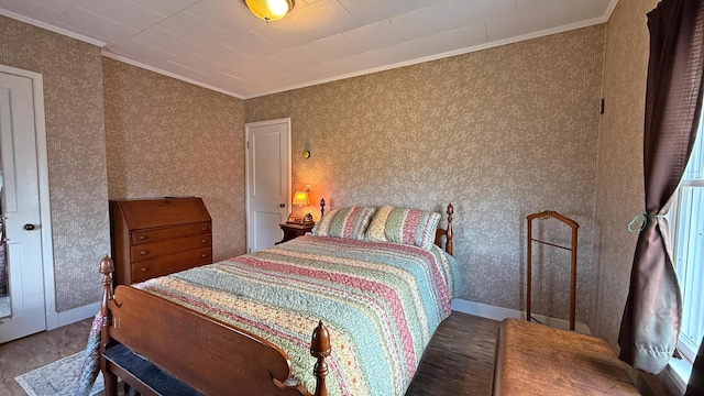 812 County Rd, Lubec, ME 04652 - bedroom with ornamental molding, wallpapered walls, and wood finished floors