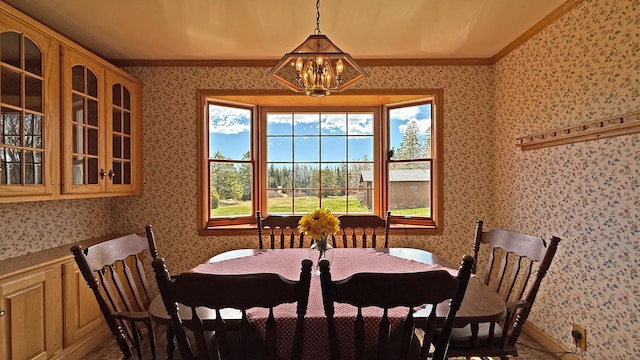 812 County Rd, Lubec, ME 04652 - dining area featuring wallpapered walls, ornamental molding, a chandelier, and baseboards
