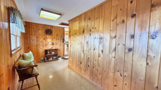 812 County Rd, Lubec, ME 04652 - corridor with tile patterned floors, wooden walls, and baseboards