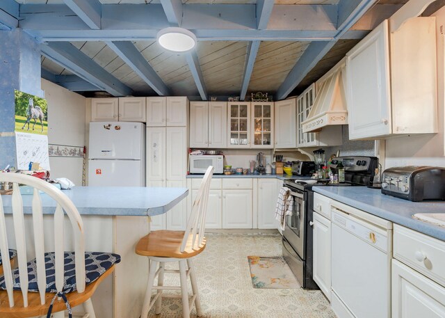 84 Hillside Rd, Westbrook, ME 04092 - kitchen featuring beamed ceiling, wooden ceiling, a breakfast bar area, and white appliances