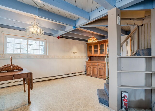 84 Hillside Rd, Westbrook, ME 04092 - below grade area with wood ceiling and a baseboard radiator