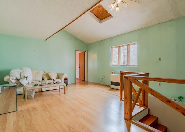 84 Hillside Rd, Westbrook, ME 04092 - living area with vaulted ceiling and wood finished floors