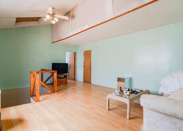 84 Hillside Rd, Westbrook, ME 04092 - sitting room with a ceiling fan, wood finished floors, and high vaulted ceiling