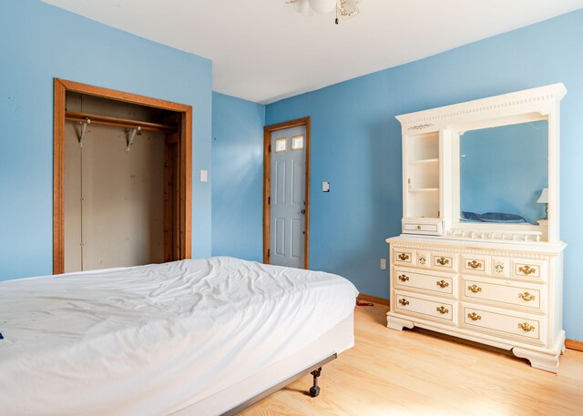 84 Hillside Rd, Westbrook, ME 04092 - bedroom with baseboards, wood finished floors, and a closet
