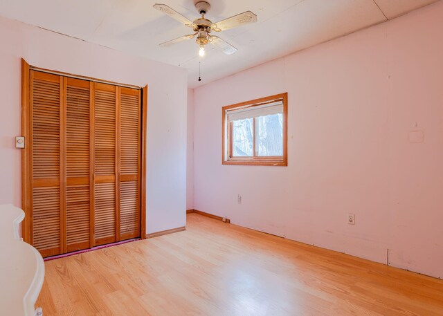 84 Hillside Rd, Westbrook, ME 04092 - unfurnished bedroom featuring a closet, light wood finished floors, and a ceiling fan