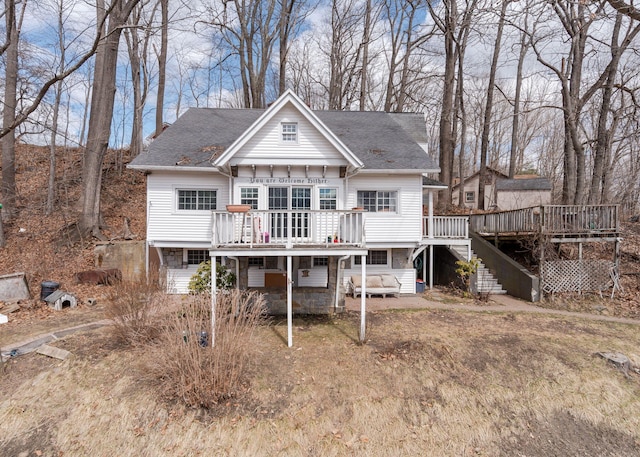 84 Hillside Rd, Westbrook, ME 04092 - rear view of house with stairway, a wooden deck, and a shingled roof