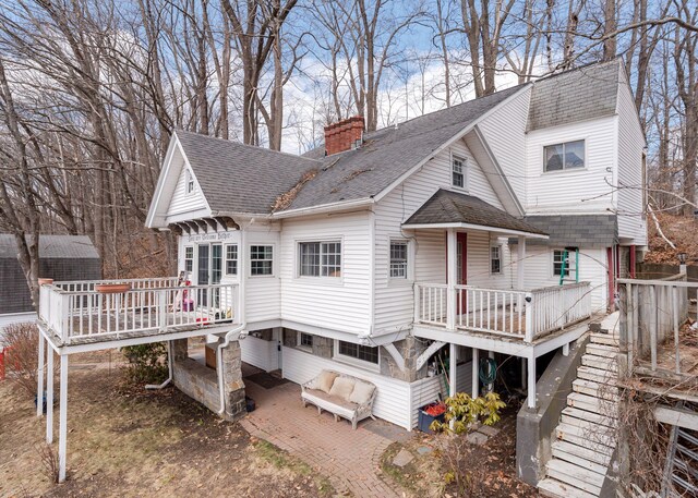 84 Hillside Rd, Westbrook, ME 04092 - rear view of house with a chimney, roof with shingles, a patio area, and a deck