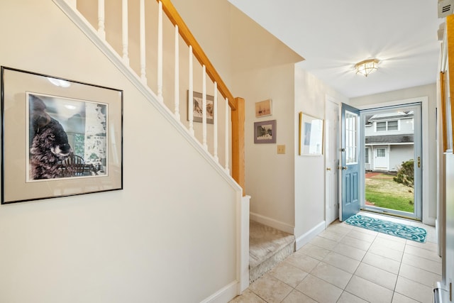 12 Ephraim Tyler Way Unit 12, Kennebunk, ME 04043 - entryway with baseboards, light tile patterned floors, and stairs