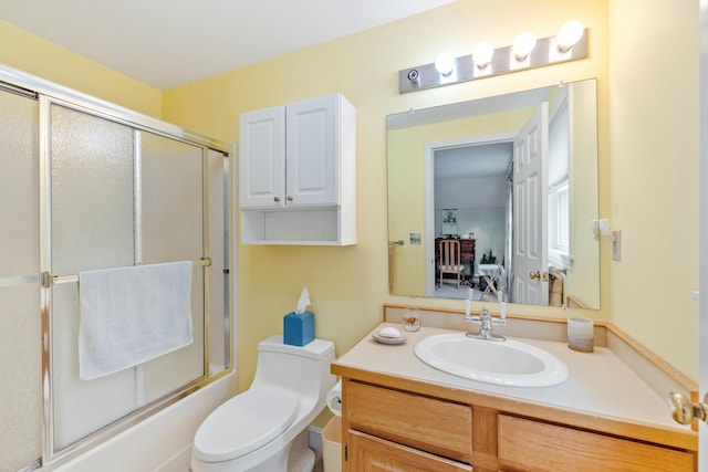 12 Ephraim Tyler Way Unit 12, Kennebunk, ME 04043 - full bathroom featuring vanity, bath / shower combo with glass door, and toilet