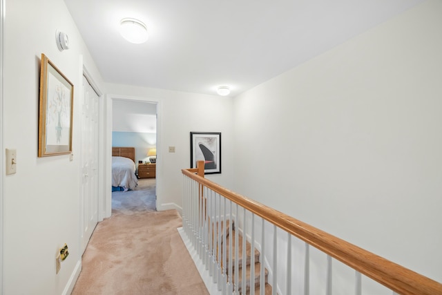 12 Ephraim Tyler Way Unit 12, Kennebunk, ME 04043 - hallway featuring light colored carpet and an upstairs landing