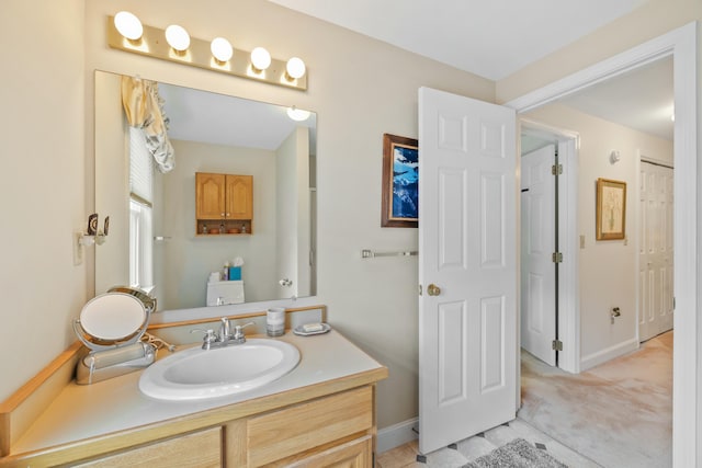 12 Ephraim Tyler Way Unit 12, Kennebunk, ME 04043 - bathroom with vanity and baseboards