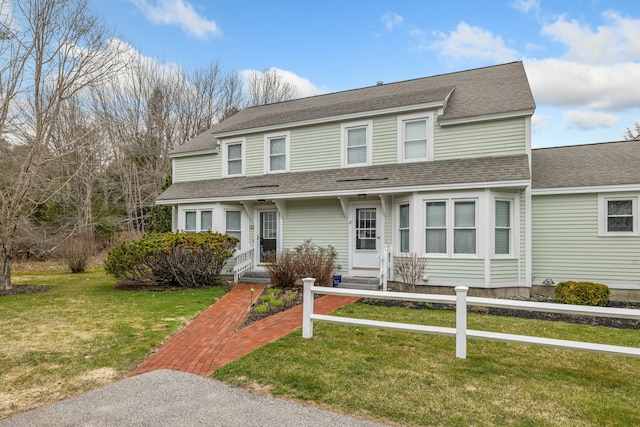 12 Ephraim Tyler Way Unit 12, Kennebunk, ME 04043 - view of front facade featuring roof with shingles and a front yard