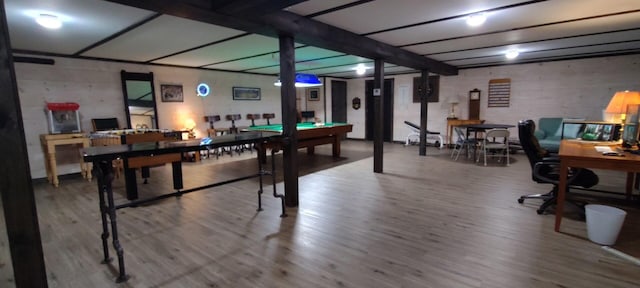 game room with wood finished floors and pool table