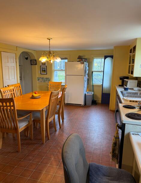 14 Ash Swamp Rd, Scarborough, ME 04074 - dining room featuring plenty of natural light, a chandelier, and arched walkways