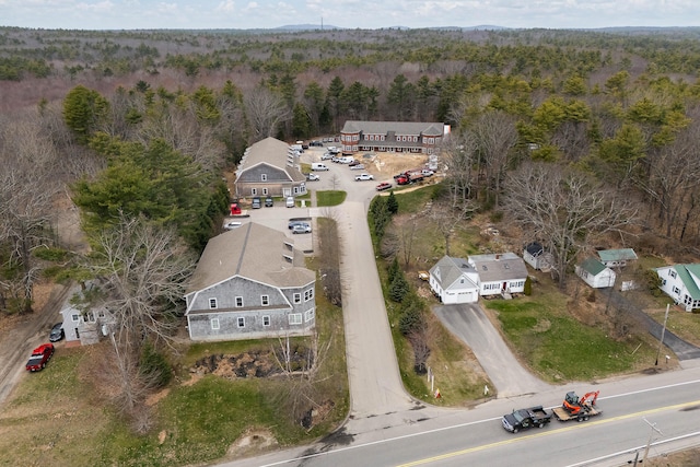 drone / aerial view featuring a view of trees