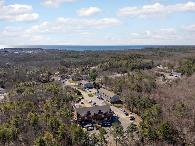 drone / aerial view featuring a forest view
