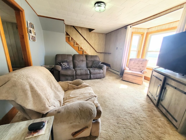 9 Locust St, Madison, ME 04950 - living room with stairs, wood walls, crown molding, light carpet, and baseboard heating